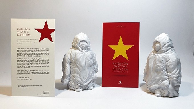 The statues featuring children wearing protective suits (Photo: NDO)