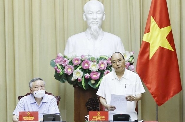 President Nguyen Xuan Phuc speaking at the working session. (Photo: VNA)