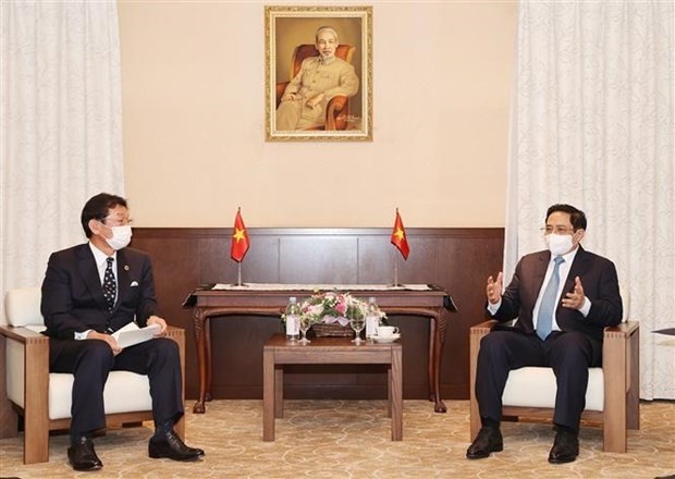 PM Pham Minh Chinh (R) and CEO of ENEOS Group Sugimori Tsutomu (Photo: VNA)