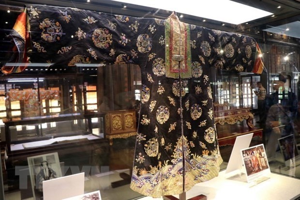 The silk dress dating back to the Nguyen dynasty is on display (Photo: VNA)