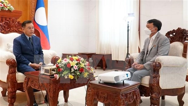 Chairman of the Lao NA Saysomphone Phomvihane (L) grants an interview to the Vietnam News Agency. (Photo: VNA)