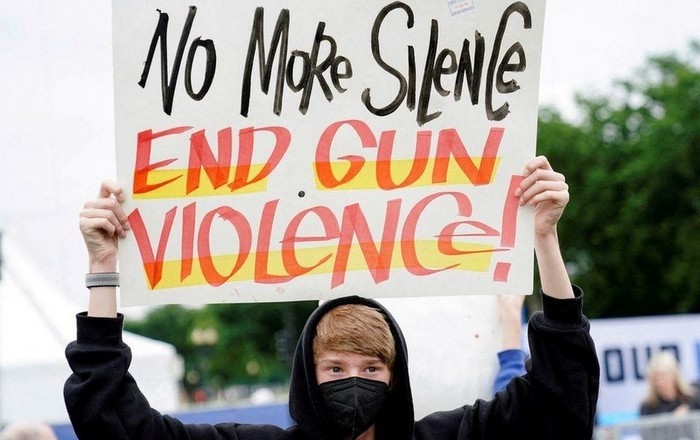 A demonstrator holds a placard while taking part in the 'March for Our Lives', one of a series of nationwide protests against gun violence, in Washington, D.C., the US. (Photo: Reuters)
