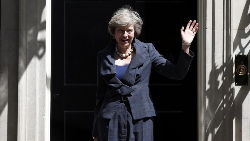 Britain's Home Secretary Theresa May, who is due to take over as prime minister on Wednesday, waves as she leaves after a cabinet meeting at number 10 Downing Street, in central London, Britain. (Credit: Reuters)