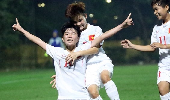 Striker Tuyet Ngan celebrates after scoring Vietnam's second goal against Iran on November 6.
