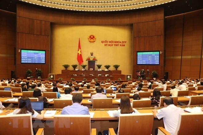 NA deputies voted to pass the programme of building laws and ordinances in 2019 and adjustments to the programme for 2018. (Photo: VNA)