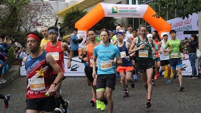 Over 750 runners join the "Run 4 Tigers" half-marathon race in Hanoi on December 9, as part of efforts to raise public awareness of protecting tigers from the risk of extinction.