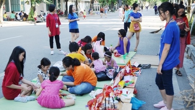 A cultural activity at the Hoan Kiem Lake pedestrian zone.