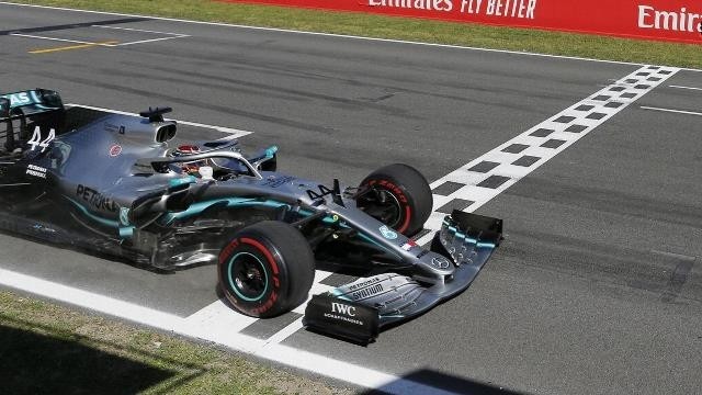 FILE PHOTO: Formula One F1 - Spanish Grand Prix - Circuit de Barcelona-Catalunya, Barcelona, Spain - May 12, 2019 Mercedes' Lewis Hamilton crosses the finish line. REUTERS/Jon Nazca/Pool