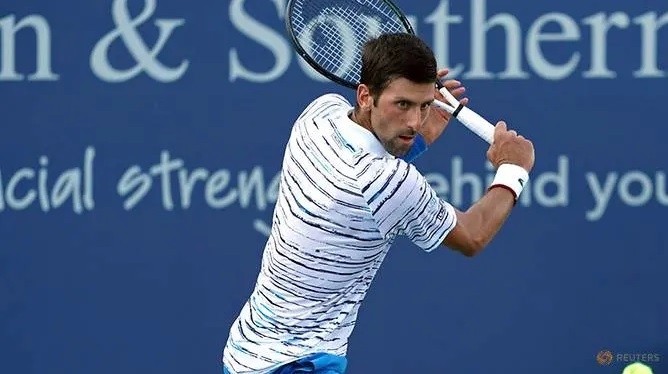 FILE PHOTO: Aug 13, 2019; Mason, OH, USA; Novak Djokovic (SRB) returns a shot against Sam Querrey (USA) during the Western and Southern Open tennis tournament at Lindner Family Tennis Center. (Reuters)