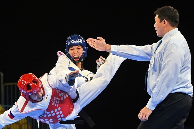 Truong Thi Kim Tuyen (in blue) is striving to accumulate points to secure a place in next year's Tokyo Olympics.