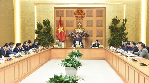 The meeting between PM Nguyen Xuan Phuc and his economic advisory group (Photo: NDO/Tran Hai)