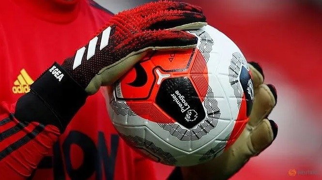 Soccer Football - Premier League - Manchester United v Watford - Old Trafford, Manchester, Britain - February 23, 2020 General view of a match ball held by Manchester United's David de Gea during the warm up before the match. (Reuters)