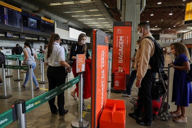 People walk at GOL Airlines check-in area at Guarulhos International Airport amid the outbreak of the coronavirus disease (COVID-19), in Guarulhos, near Sao Paulo, Brazil, May 19, 2020. (Photo: Reuters)