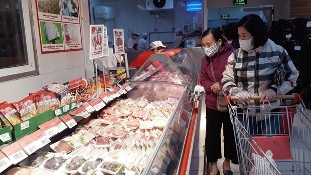 Consumers are shopping for pork at a supermarket.