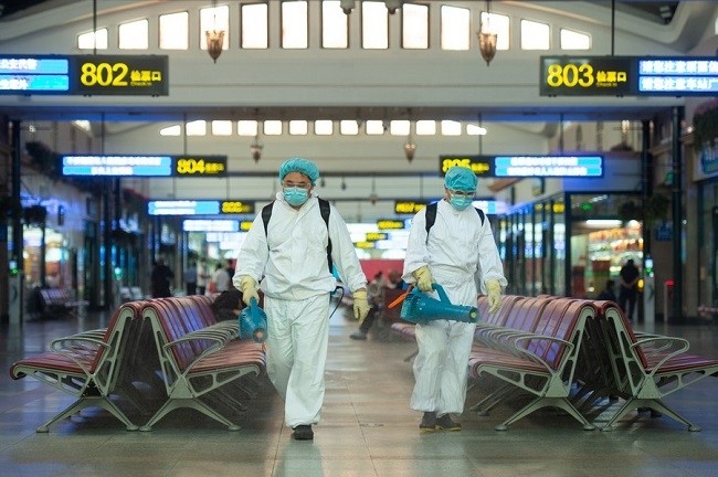 Staff members disinfect a waiting room of Beijing Railway Station in Beijing, capital of China, June 18, 2020. (Photo: Xinhua)
