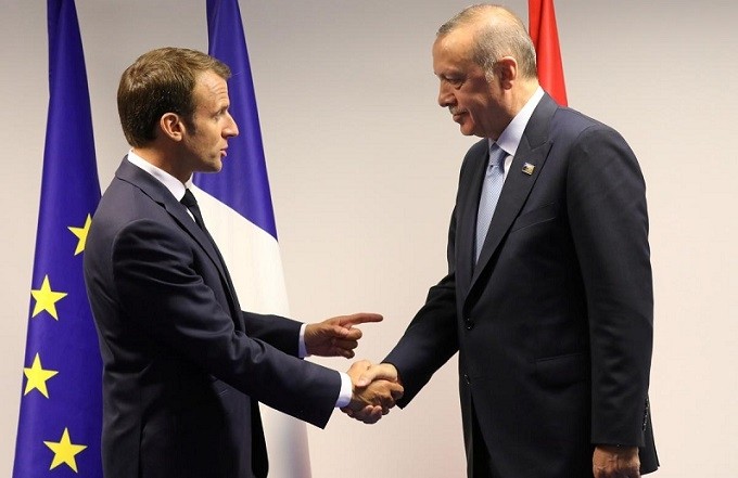 FILE PHOTO: French President Emmanuel Macron (L) shakes hands with Turkish President Recep Tayyip Erdogan before a bilateral meeting on the sidelines of a North Atlantic Treaty Organisation (NATO) summit in Brussels, Belgium July 12, 2018. (Photo: Reuters)