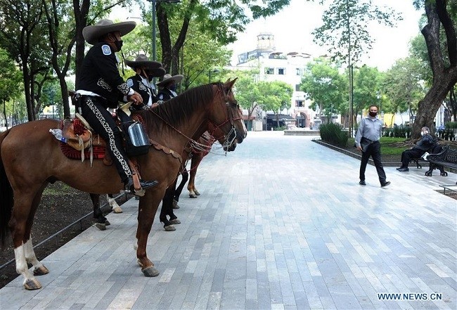 Mounted police officers wearing face masks are seen in Mexico City, Mexico, July 13, 2020. Mexico registered 4,685 new COVID-19 cases in the last 24 hours, bringing the nationwide count to 304,435, the country's health ministry said Monday. (Photo: Xinhua)