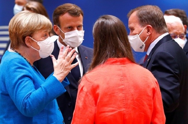 German Chancellor Angela Merkel gestures as she speaks with France's President Emmanuel Macron, Finland's Prime Minister Sanna Marin and Sweden's Prime Minister Stefan Lofven during the first face-to-face EU summit since the coronavirus disease (COVID-19) outbreak, in Brussels, Belgium July 18, 2020. (Photo: Reuters)