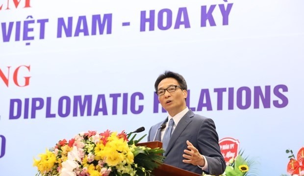 Deputy Prime Minister Vu Duc Dam addresses the event celebrating 25 years of Vietnam-US diplomatic relations in Hanoi on October 7 (Photo: VNA)
