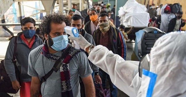 Passengers undergo thermal screening, amid coronavirus pandemic, at Bandra Terminus Railway Station. (Photo: PTI)