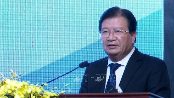 Deputy PM Trinh Dinh Dung speaking at the conference (Photo: VNA)