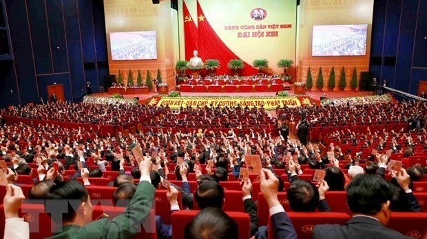 Delegates vote to approve 13th National Party Congress's Resolution (Photo: VNA)